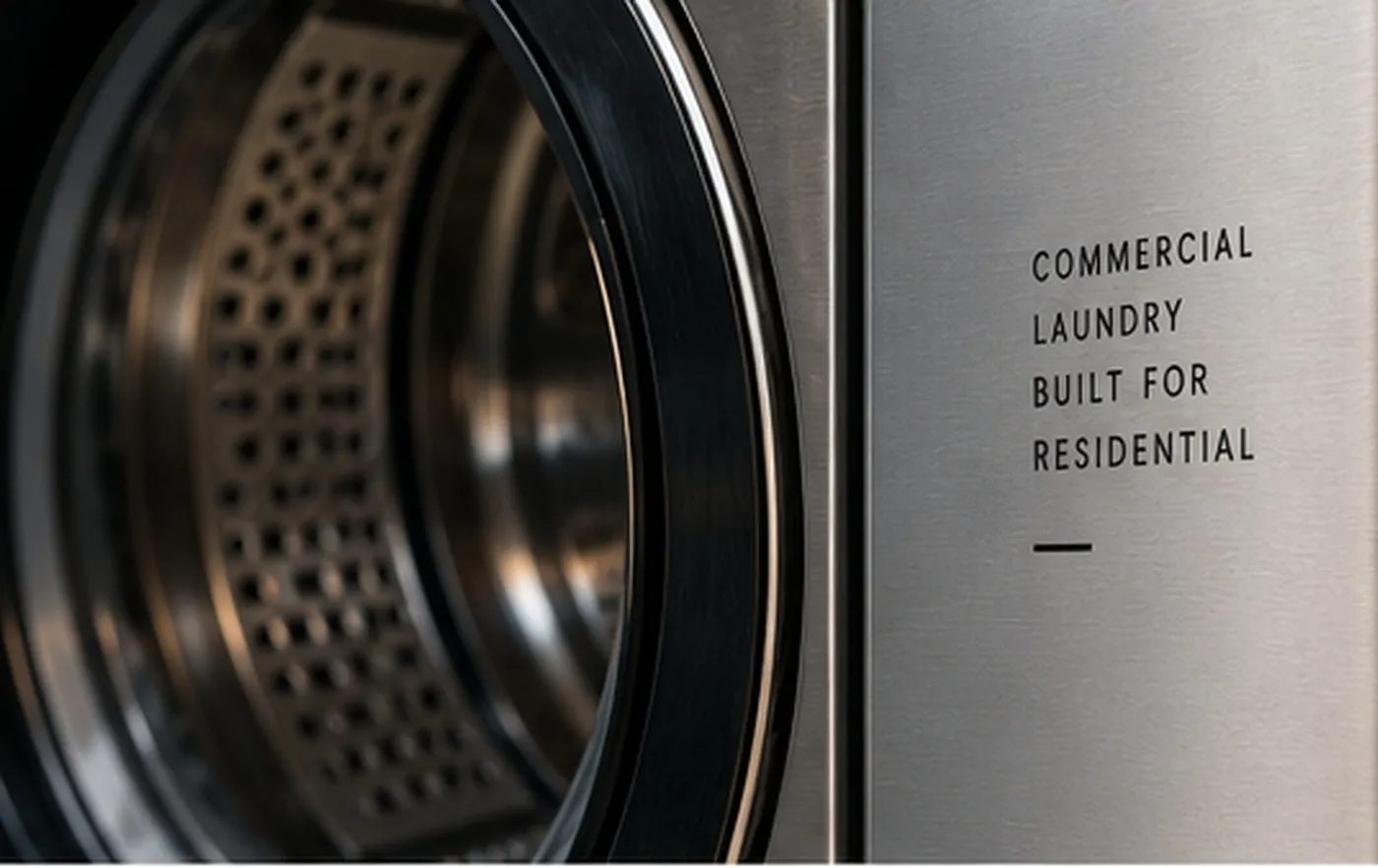Detail of commercial laundry equipment and stainless-steel drum
